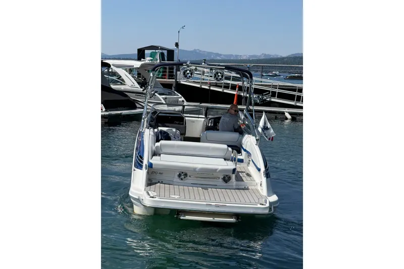 Slide: The Image of 2022 Formula 270 Bowrider boat docked on a sunny day, rear view. - 5