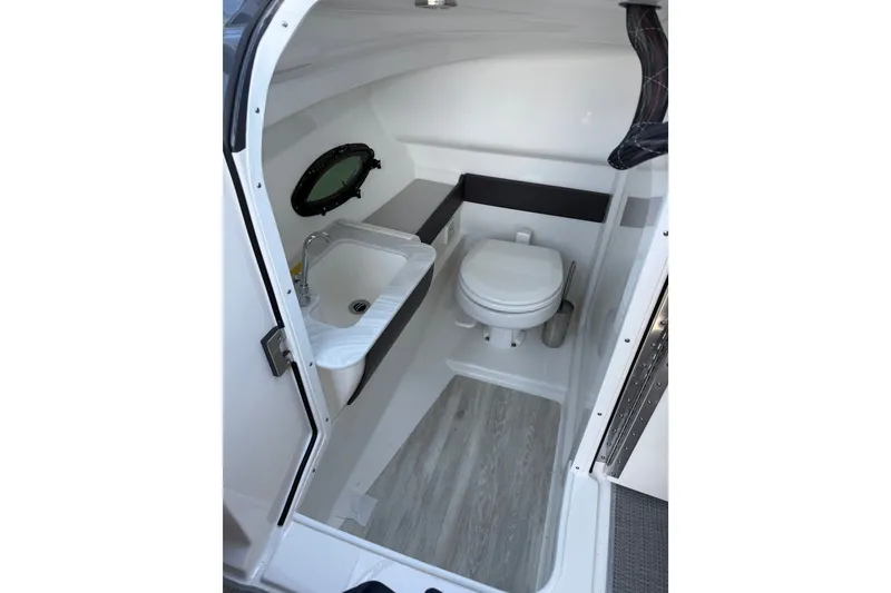 Slide: The Image of 2022 Formula 270 Bowrider interior bathroom with sink and toilet. - 11