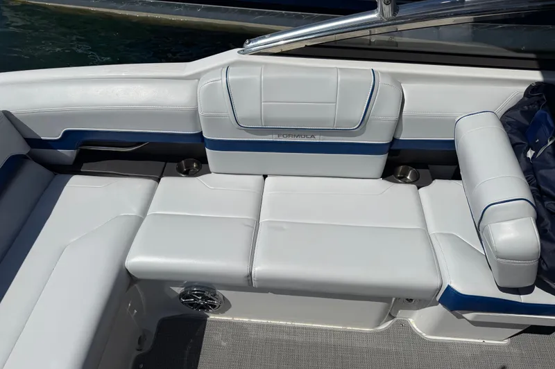 Slide: The Image of 2022 Formula 270 Bowrider interior seating with white and blue upholstery. - 14