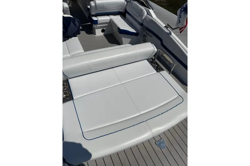 Slide: The Image of 2022 Formula 270 Bowrider interior with white cushioned seating and sleek design. - 8