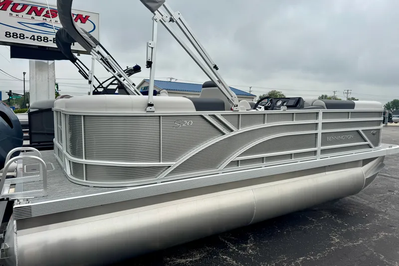 Slide: The Image of 2026 Bennington S 20 SSR pontoon boat displayed outdoors on a cloudy day. - 13