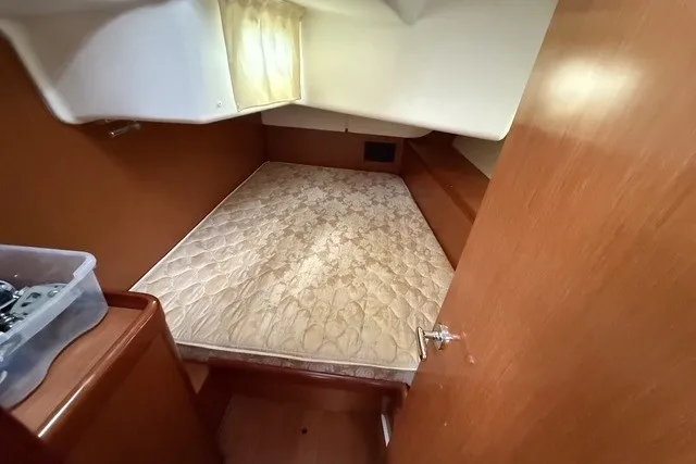 Slide: The Image of Cozy cabin interior of 2008 Beneteau Oceanis 46 sailboat with a comfortable bed. - 60