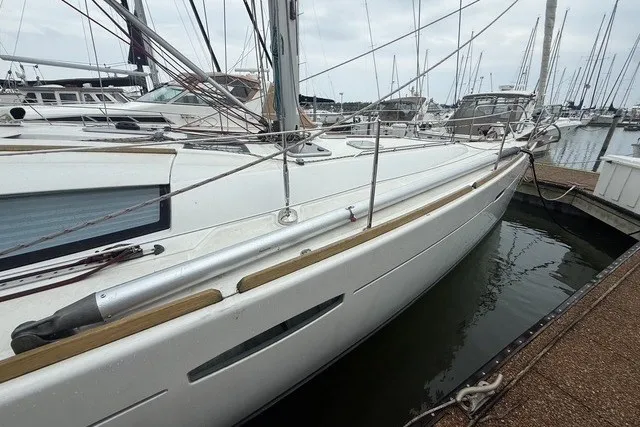 Slide: The Image of 2008 Beneteau Oceanis 46 sailboat docked in a marina, side view. - 5