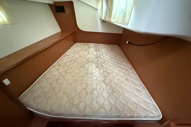 Slide: The Image of Interior cabin of 2008 Beneteau Oceanis 46 with a fitted mattress. - 56