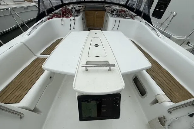 Slide: The Image of Cockpit of 2008 Beneteau Oceanis 46 sailboat with seating and navigation equipment. - 16