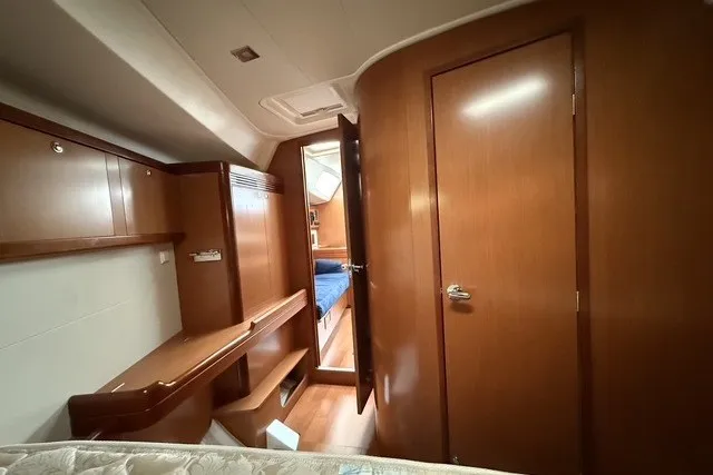 Slide: The Image of Cabin interior of 2008 Beneteau Oceanis 46 yacht with wooden furnishings. - 47