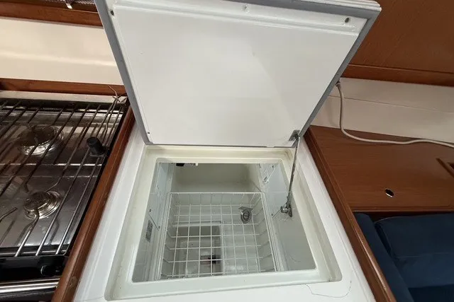 Slide: The Image of Open refrigerator in 2008 Beneteau Oceanis 46 yacht kitchen, showcasing interior storage space. - 35