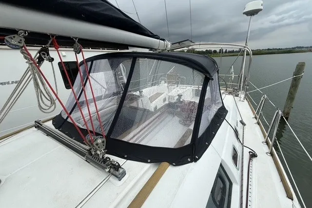 Slide: The Image of Beneteau Oceanis 46 sailboat, 2008 model, docked with protective cockpit cover. - 4