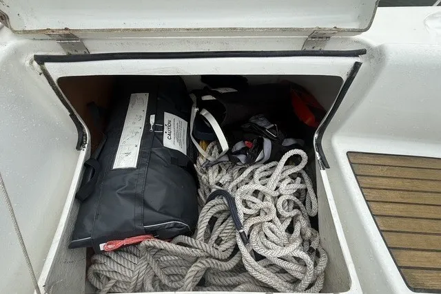 Slide: The Image of Storage compartment on a 2008 Beneteau Oceanis 46 sailboat with ropes and gear. - 25