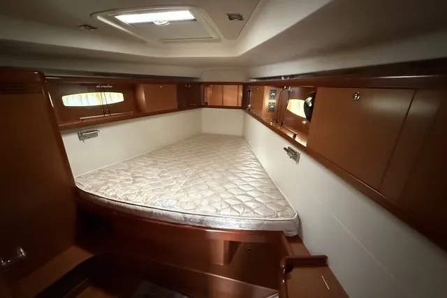 Slide: The Image of Interior cabin of 2008 Beneteau Oceanis 46 yacht with a cozy bed. - 46