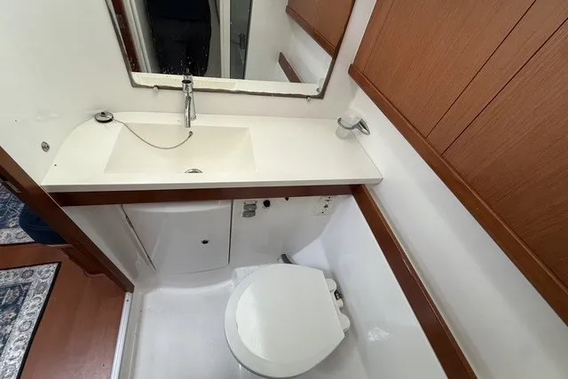 Slide: The Image of Bathroom interior of 2008 Beneteau Oceanis 46 yacht with sink and toilet. - 54