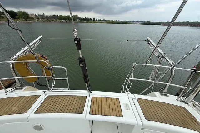Slide: The Image of Beneteau Oceanis 46 sailboat deck overlooking calm waters, 2008 model. - 14