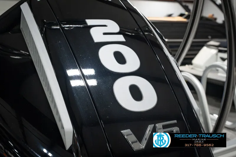 Slide: The Image of Close-up of a 2025 Bennington L 25 Quad Bench Bowrider's 200 V6 engine. - 53