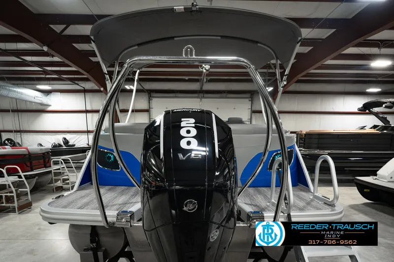 Slide: The Image of 2025 Bennington L 25 Quad Bench Bowrider with 200 V6 engine in showroom. - 9