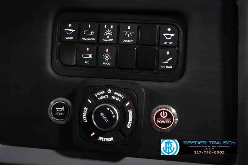 Slide: The Image of Control panel of 2025 Bennington L 25 Quad Bench Bowrider with various function buttons. - 41