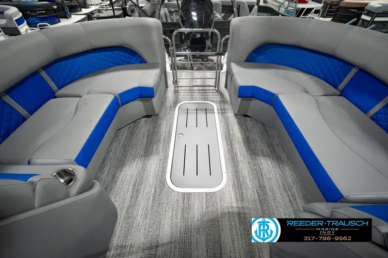 Slide: The Image of 2025 Bennington L 25 Quad Bench Bowrider interior with gray and blue seating. - 33