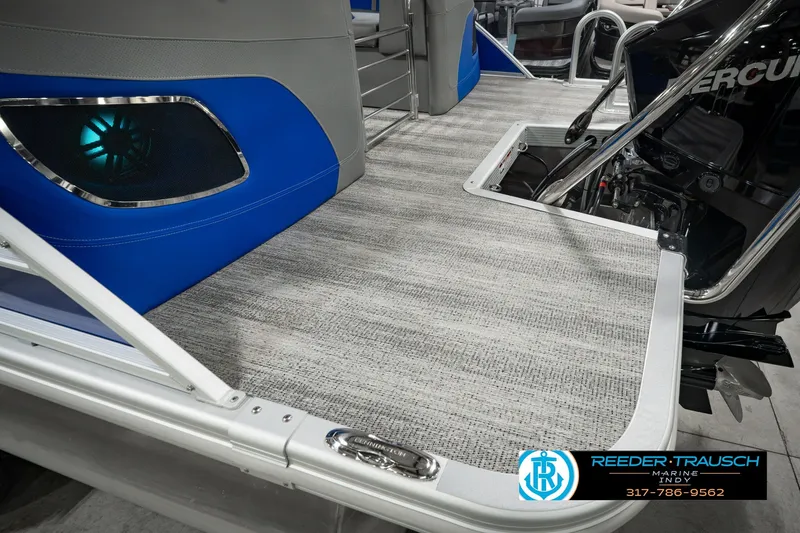 Slide: The Image of 2025 Bennington L 25 Quad Bench Bowrider interior with modern flooring and sleek design. - 61