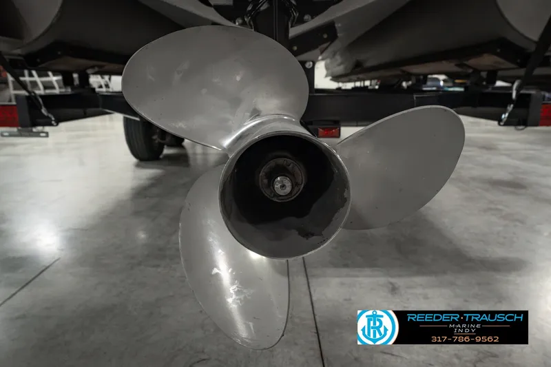 Slide: The Image of Propeller of 2025 Bennington L 25 Quad Bench Bowrider on display in showroom. - 54