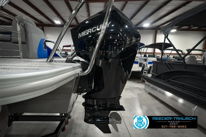 Slide: The Image of 2025 Bennington L 25 Quad Bench Bowrider with Mercury outboard engine in showroom. - 51
