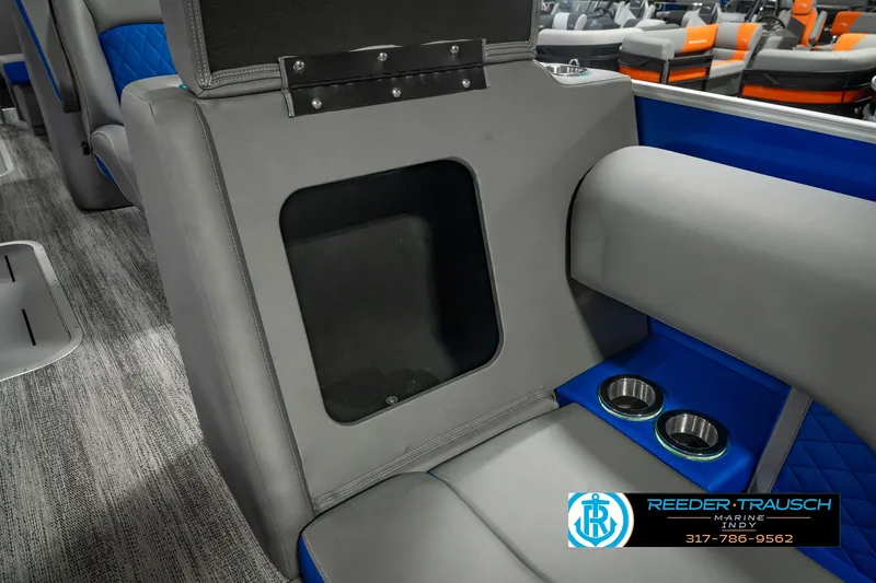 Slide: The Image of Interior of 2025 Bennington L 25 Quad Bench Bowrider with cup holders and storage compartment. - 29