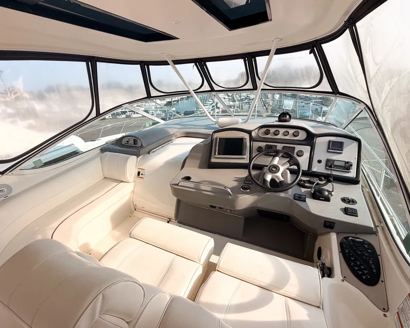 Slide: The Image of The cockpit of the 2007 Cruisers Yachts 455 Motor Yacht features sleek design, comfortable seating, and modern electronics. - 4