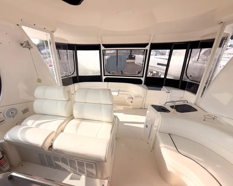 Slide: The Image of Interior of a 2007 Cruisers Yachts 455 Motor Yacht with white leather seating. - 6