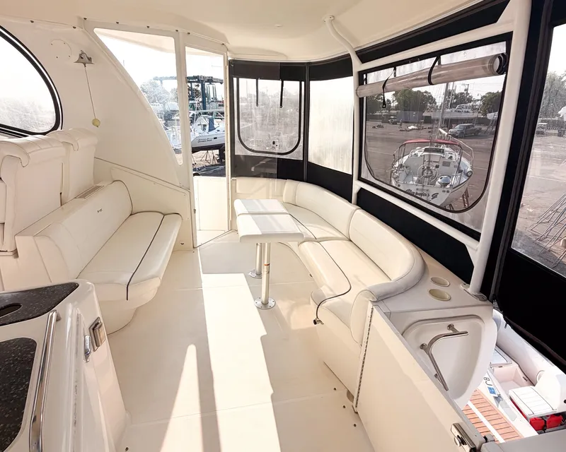 Slide: The Image of The 2007 Cruisers Yachts 455 Motor Yacht features an elegant interior with white leather seating. - 9