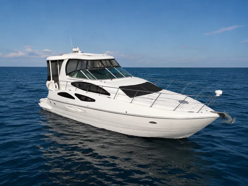 The Image of A luxurious white motor yacht from 2007 on calm waters under a blue sky. - 0