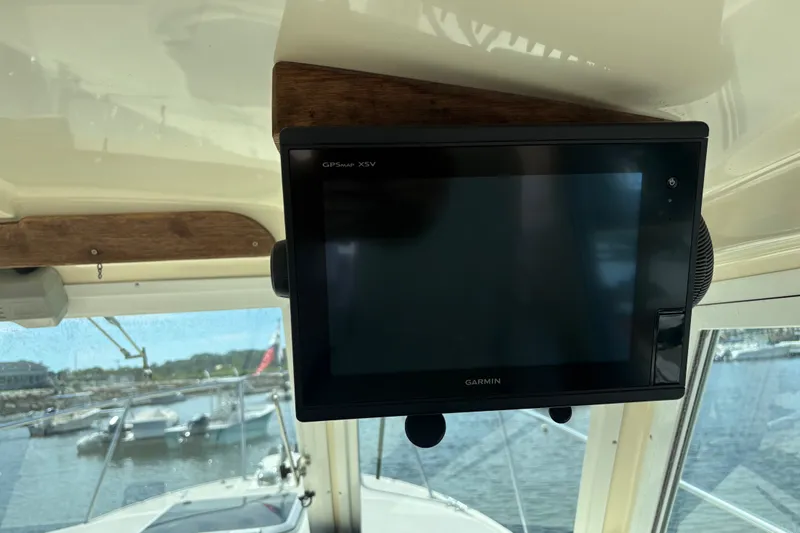 Slide: The Image of Garmin GPSMAP XSV on 1998 Albin 28 Tournament Express boat, docked with marina view. - 9