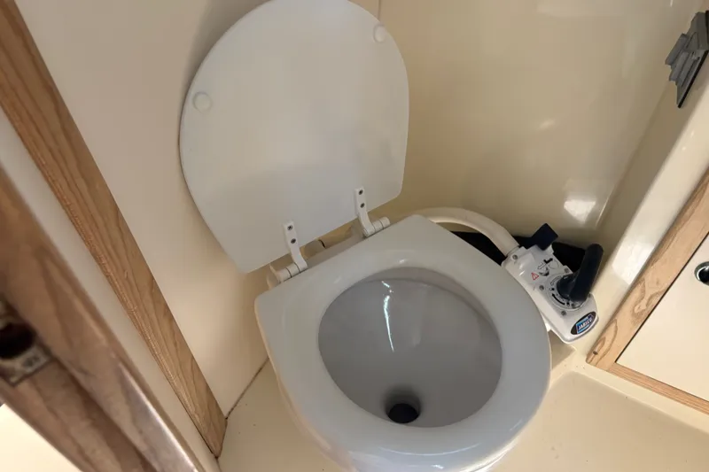 Slide: The Image of Marine toilet in 1998 Albin 28 Tournament Express boat bathroom. - 6