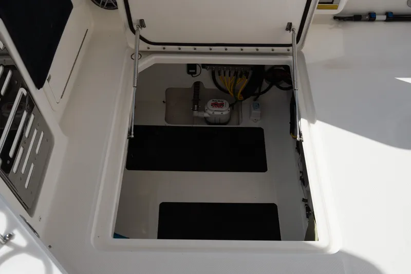 Slide: The Image of 2024 World Cat 400 DC-X boat storage compartment with open hatch. - 29
