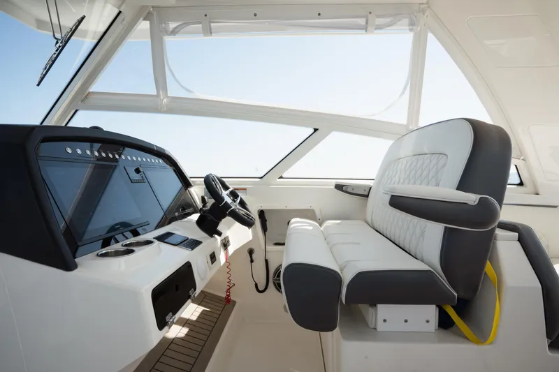 Slide: The Image of 2024 World Cat 400 DC-X helm with modern controls and luxurious seating. - 16