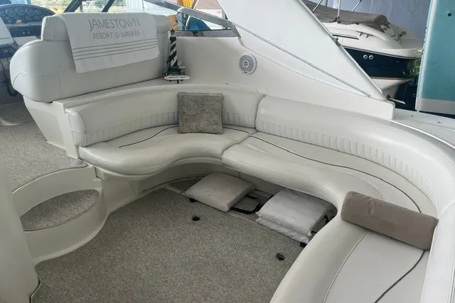 Slide: The Image of 2001 Cruisers Yachts 4270 Express interior with plush seating and elegant design. - 16