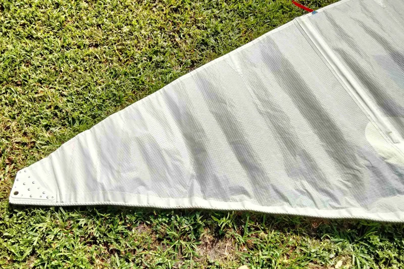 Slide: The Image of Close-up of a Rebel Mark IV sail on grass, 2001 model. - 17