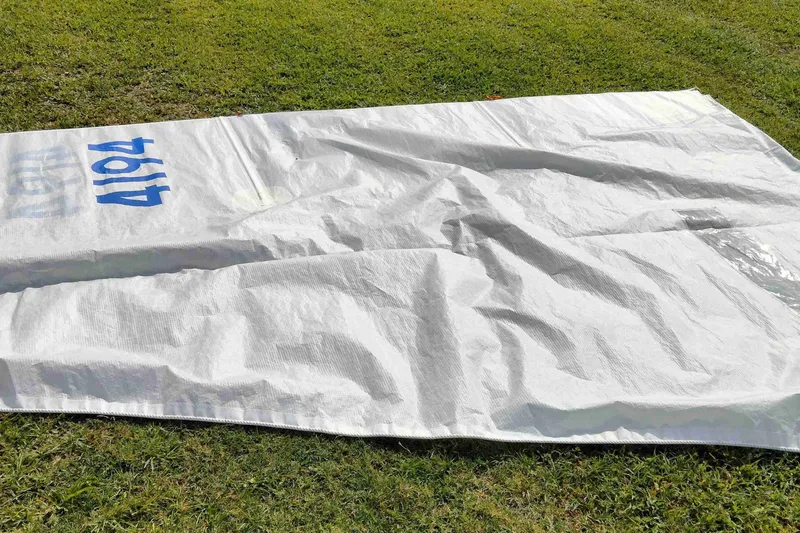 Slide: The Image of White tarp with blue numbers "4194" on grass, captured by Rebel Mark IV, 2001. - 19