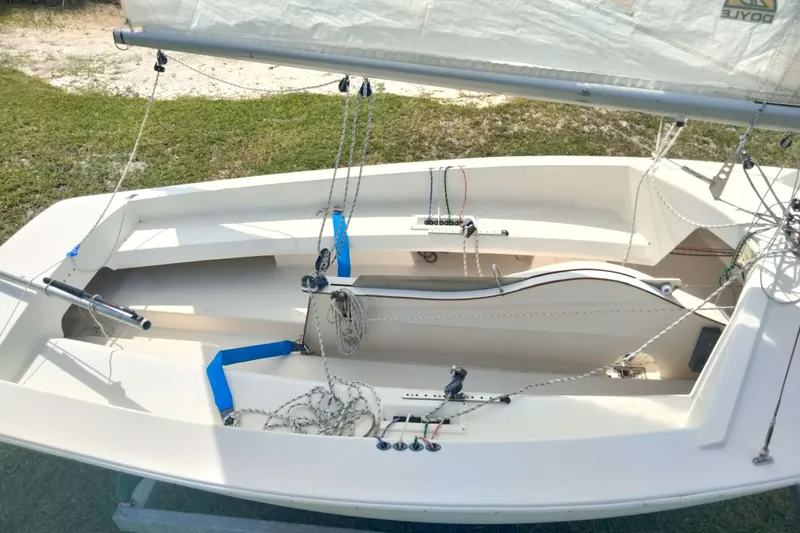 Slide: The Image of Sailboat interior with rigging, Rebel Mark IV, 2001 model, on grassy area. - 14