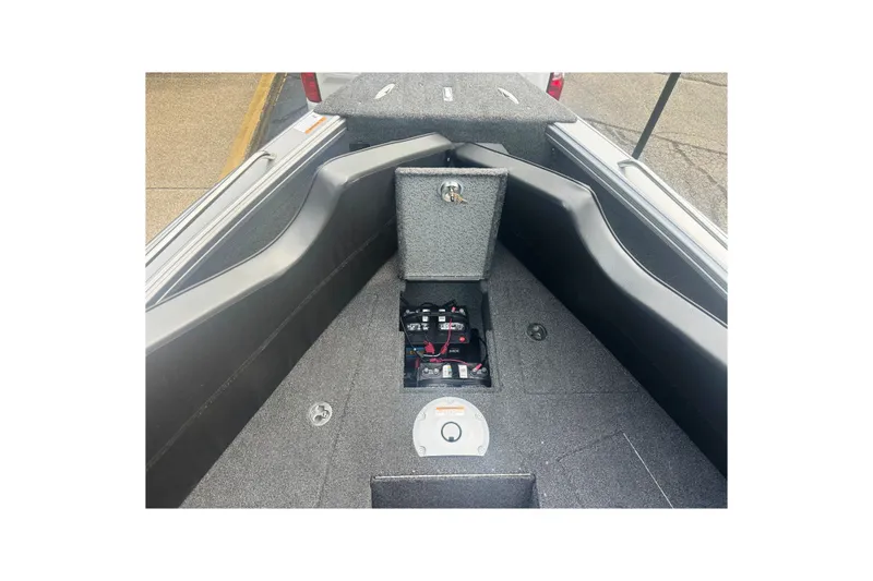 Slide: The Image of 2025 Lund 2275 Baron boat interior with battery compartment and storage area. - 25