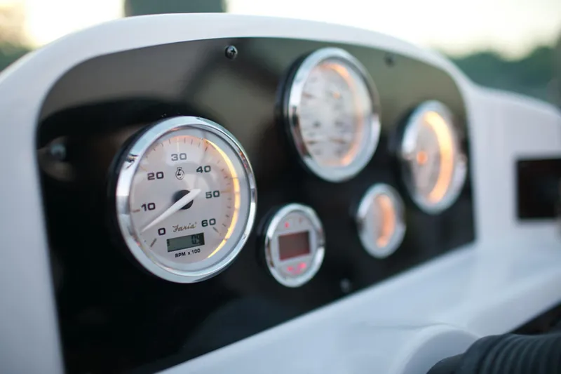 Slide: The Image of Manufacturer Provided Image: Close-up of 2013 Hurricane SunDeck 187 OB boat dashboard with gauges. - 6
