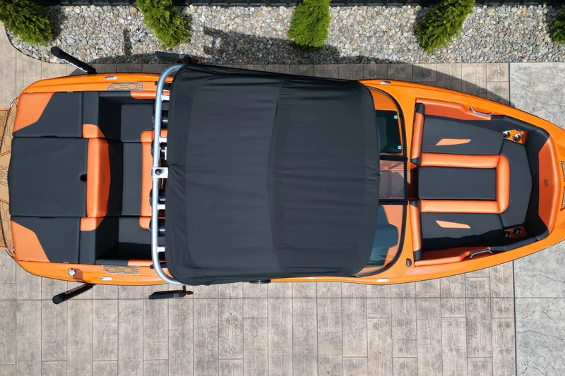Slide: The Image of Overhead view of 2022 MasterCraft NXT24 boat with orange and black seating. - 17