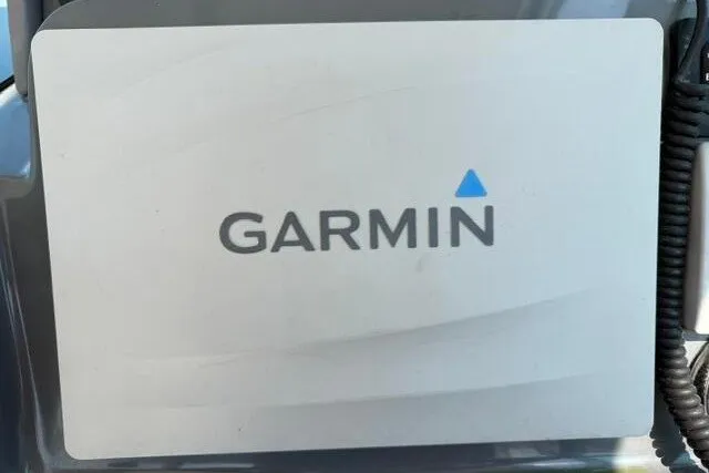 Slide: The Image of Garmin device on 2010 Pursuit OS 285 Offshore boat dashboard. - 48