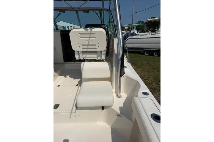 Slide: The Image of 2010 Pursuit OS 285 Offshore boat interior with seating and helm station. - 30