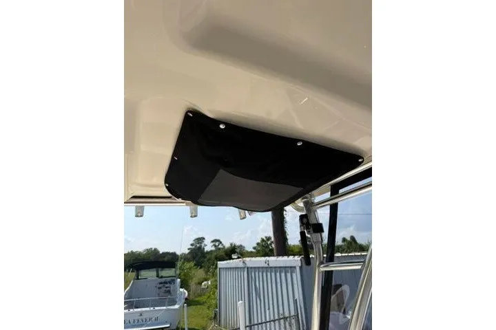 Slide: The Image of 2010 Pursuit OS 285 Offshore boat interior with black ceiling panel. - 54
