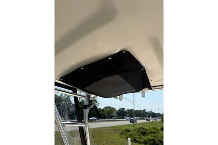 Slide: The Image of 2010 Pursuit OS 285 Offshore boat interior detail with black fabric panel. - 53