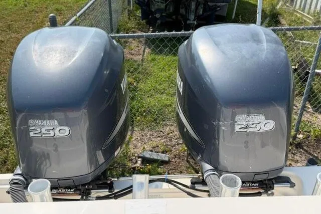 Slide: The Image of Twin Yamaha 250 engines on a 2010 Pursuit OS 285 Offshore boat. - 20