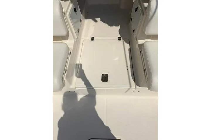 Slide: The Image of 2010 Pursuit OS 285 Offshore boat interior with seating and storage compartments. - 33