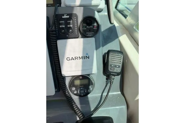 Slide: The Image of Control panel of a 2010 Pursuit OS 285 Offshore boat with Garmin electronics. - 49