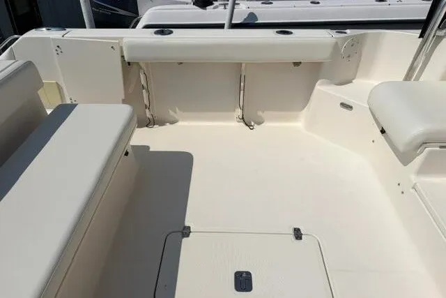 Slide: The Image of Spacious deck of 2010 Pursuit OS 285 Offshore boat with seating and storage. - 23