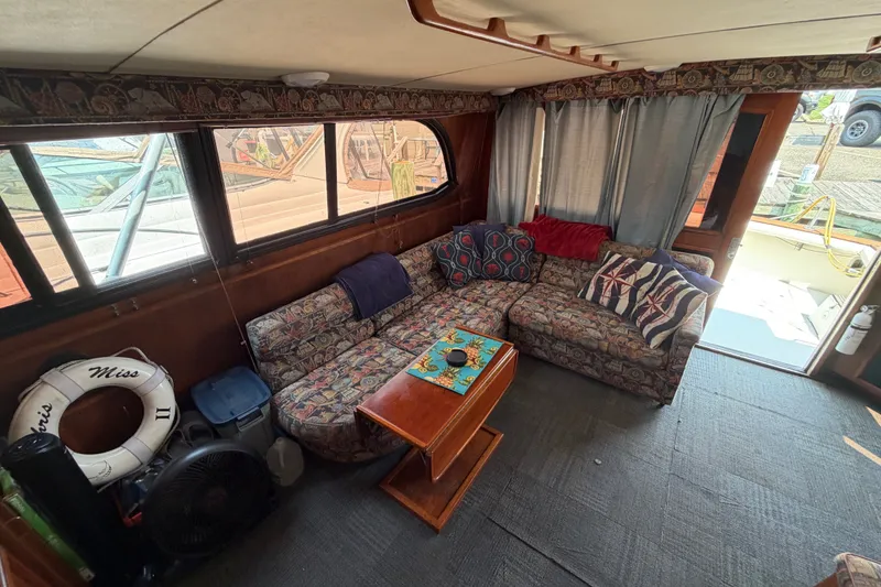 Slide: The Image of Interior of 1989 Egg Harbor 41 Convertible yacht with cozy seating and nautical decor. - 19
