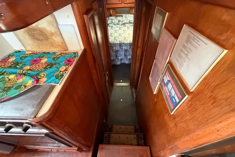 Slide: The Image of Interior of 1989 Egg Harbor 41 Convertible with wood paneling and colorful decor. - 21