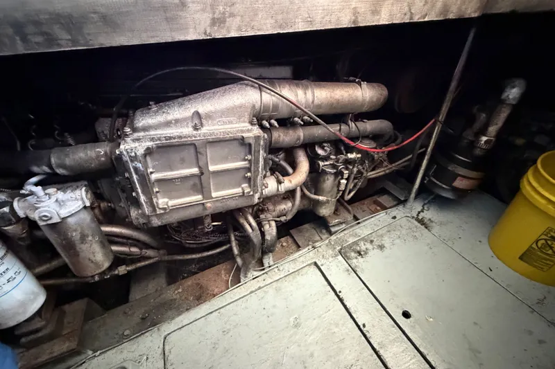 Slide: The Image of Engine room of a 1989 Egg Harbor 41 Convertible boat, showcasing machinery and components. - 49